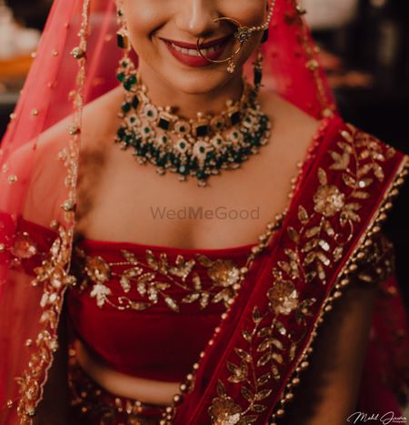 Trendy bridal lehenga with red off shoulder blouse