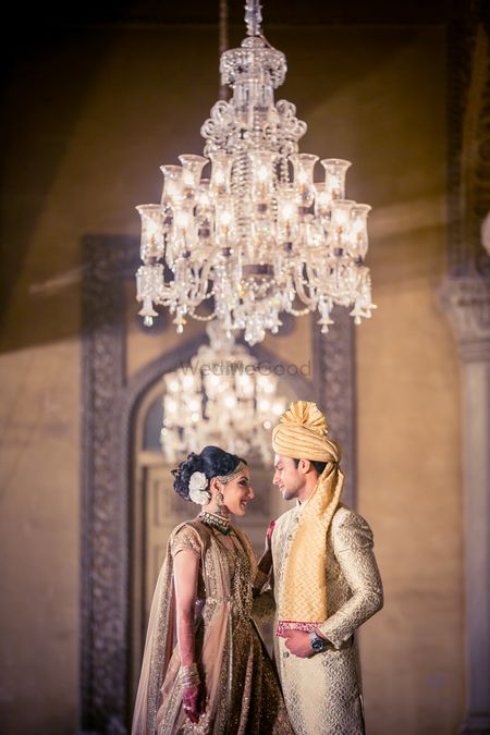 Photo of Couple in gold bridal outfits