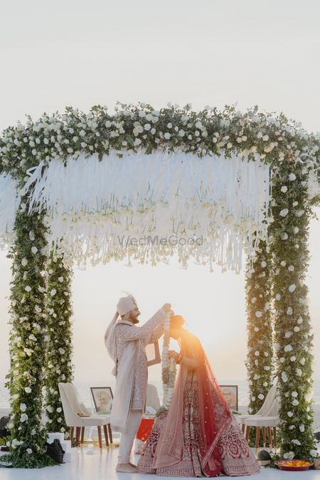 Photo of Lovely circular outdoor mandap with white and green floral decor