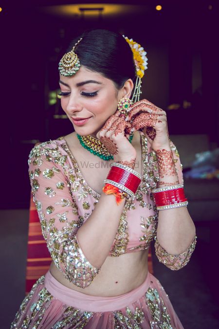 A bride wears her jewellery as she gets ready for he big day. 