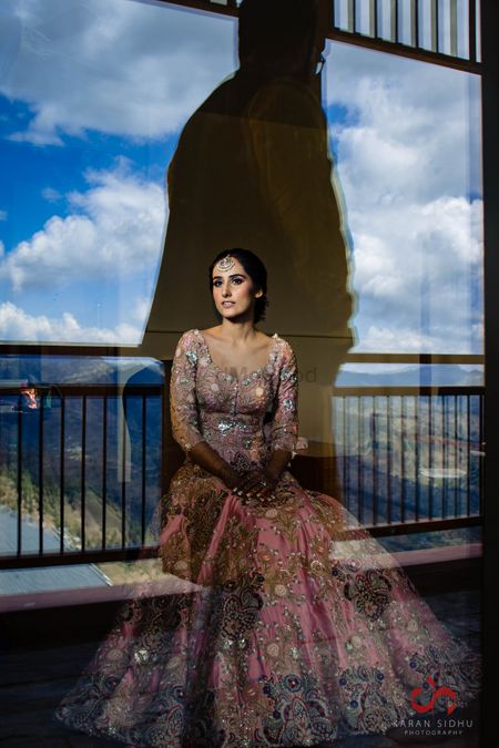 Photo of Gorgeous bridal portrait on wedding day clicked while bride was getting ready