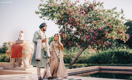 Photo of A color-coordinated couple pose ahead of their Anand Karaj ceremony