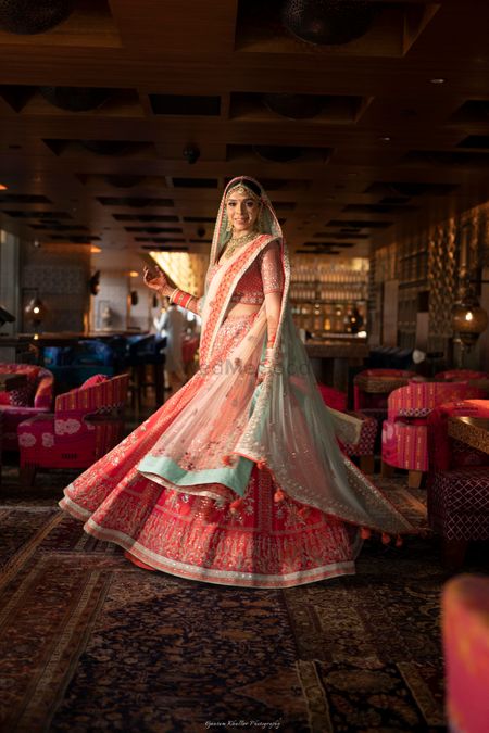 Photo of Anita dongre bridal lehenga in red and green