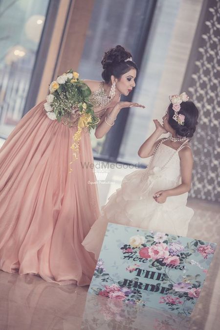Photo of indian bride with neice blowing kiss