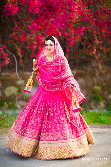 Photo of Fuschia pink bridal lehenga