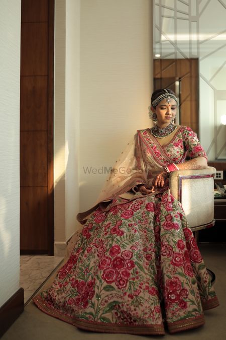 Photo of Bride wearing a floral embellished lehenga for her wedding day