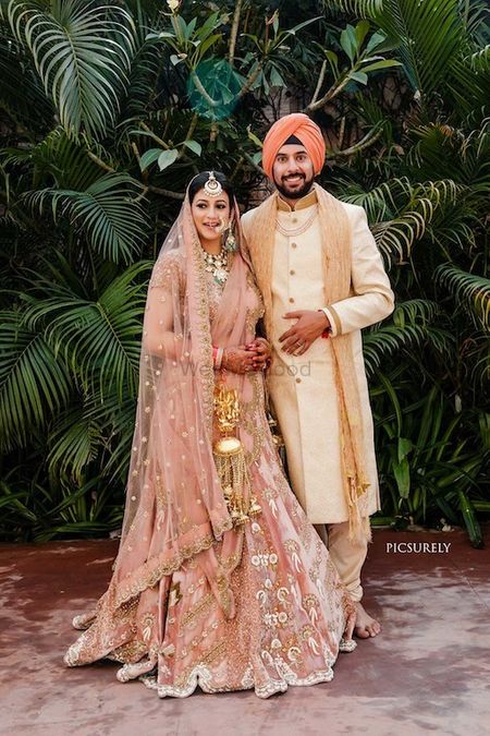 Photo of Sikh couple shot with matching turban and lehenga