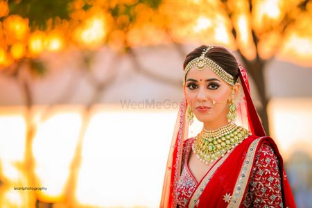 Bridal portrait with contrasting jewellery and red lehenga