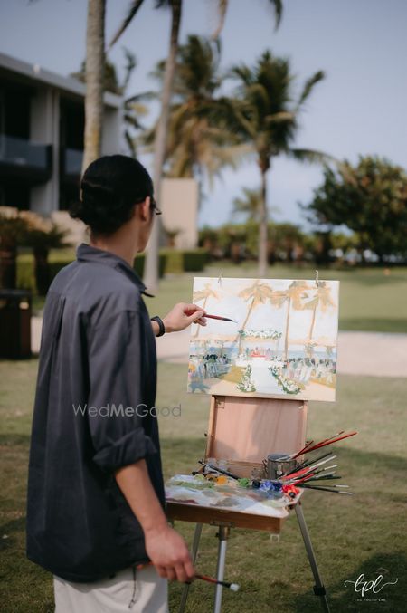 Unique idea of a live painting set up for the wedding day