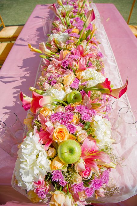 Table decor runner with fruits in it 