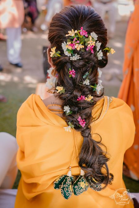 A beautiful braid decorated with little flowers.