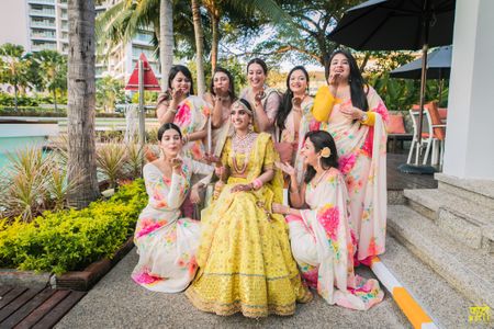 Photo of Bride and bridesmaids in a candid fun shot