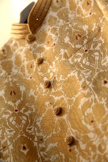 brocade sherwani in gold and white with gold buttons