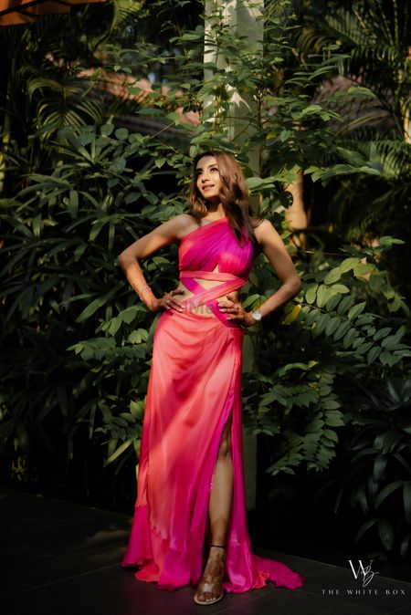 Photo of Super glam bridal portrait in a cut-out gown in shades of pink