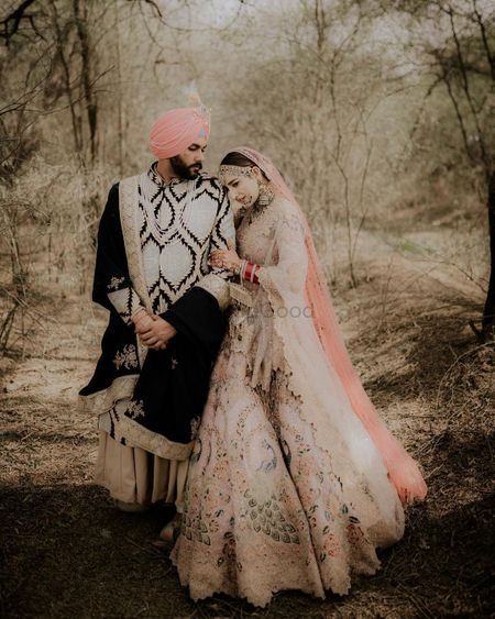 romantic couple pose for anand karaj wedding