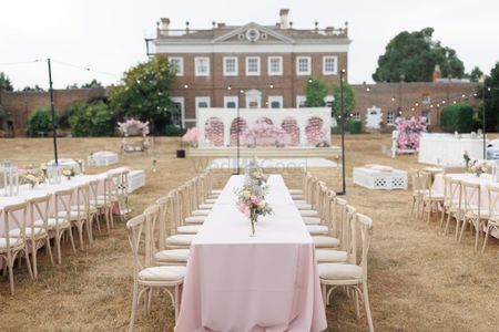 Photo of pink floral long table setting