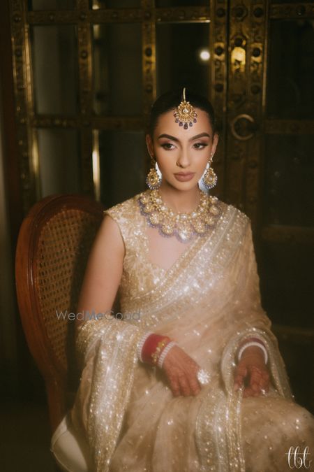 A nude makeup look with bold eyebrows for this bridal look