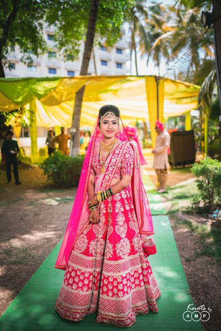 Bride in red lehenga for north indian wedding