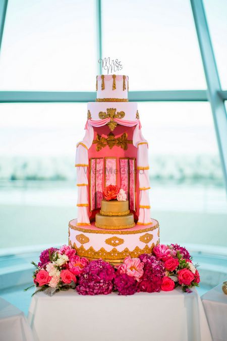 Photo of Unique Wedding Cake Design in Pink with Flowers