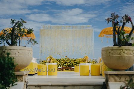 Photo of Pretty all-yellow haldi decor with florals for an outdoor event