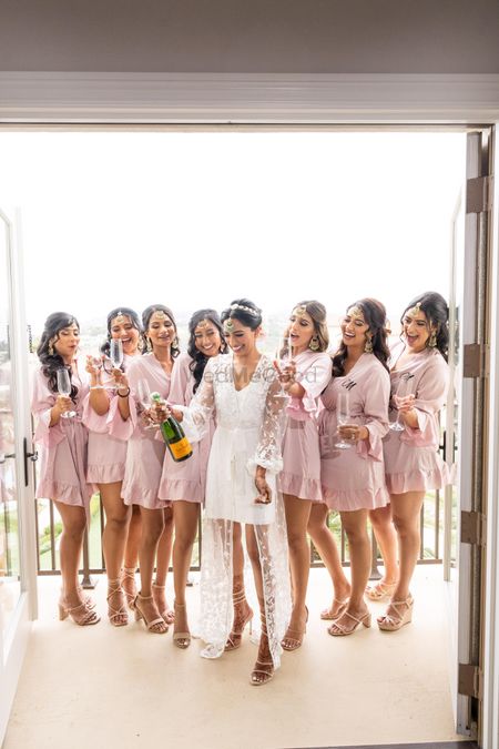 Photo of Bride and bridesmaids with matching robes