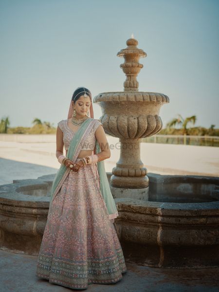 Photo of pink and blue pastel bridal lehenga with contrasting dupatta