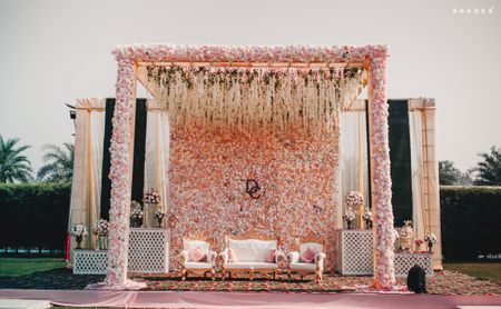 Artistic floral stage decor for the bride and groom. 