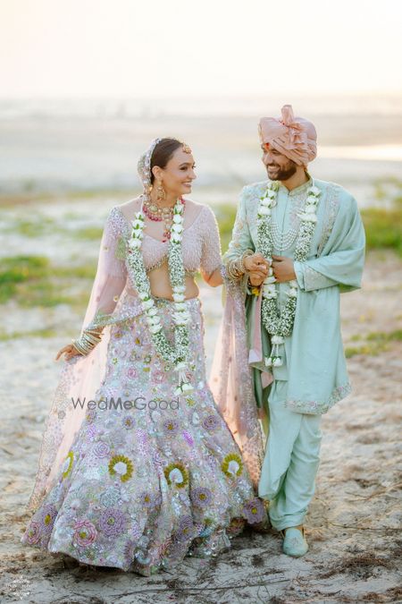 pastel bride and groom look with coordinated outfits