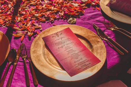 Menu on gold plate at Indian wedding