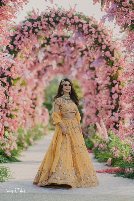 Photo of Happy shot in a mango yellow lehenga with emerald jewellery and a passa