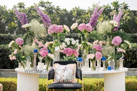 Breathtaking floral arrangements in purple and pink florals for a table set up