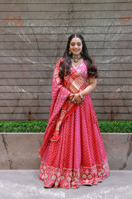 Gorgeous bandhani lehenga in different shades of pink with a triangular drape 
