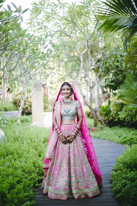 Photo of Mint green and pink bridal lehenga
