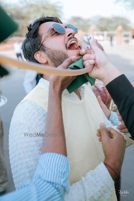 Fun baraat shot with baraatis drinking and dancing 