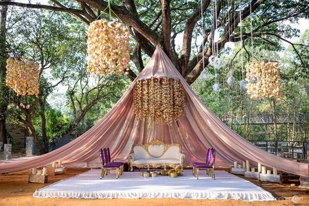 Photo of Gorgeous floral mandap with hanging strings