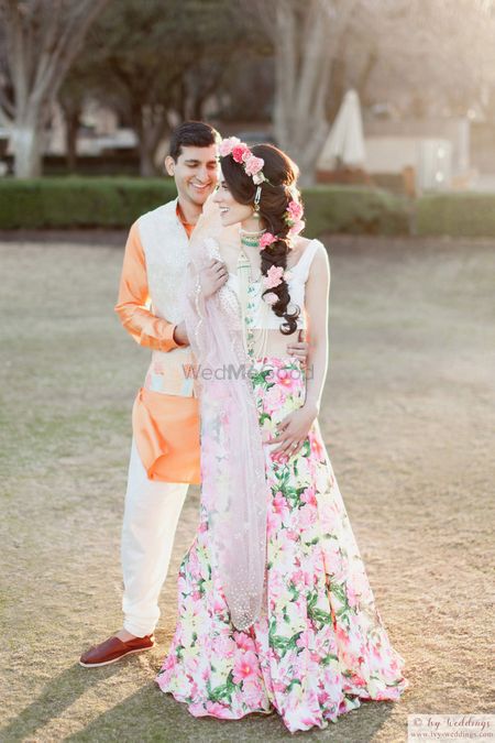 Photo of Floral print mehendi lehenga with floral hairstyle