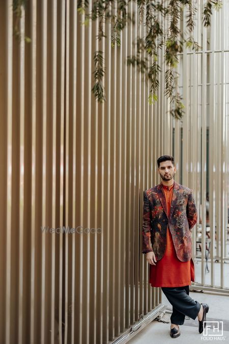 Unique jacket and kurta look for the groom for the mehendi ceremony in orange and brown