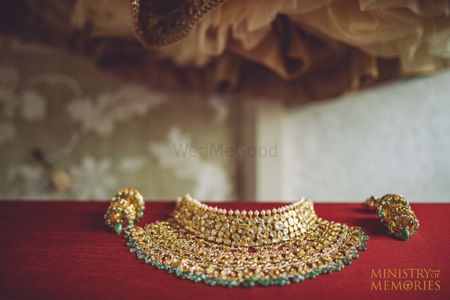 Bridal choker with green beads on display