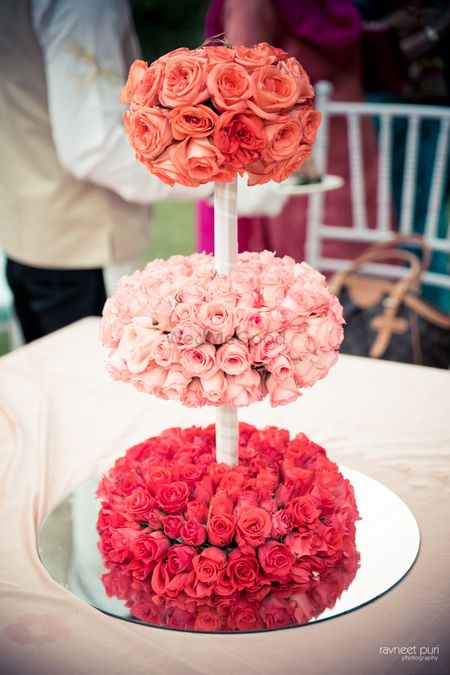 Tiered floral table centerpieces with mirror