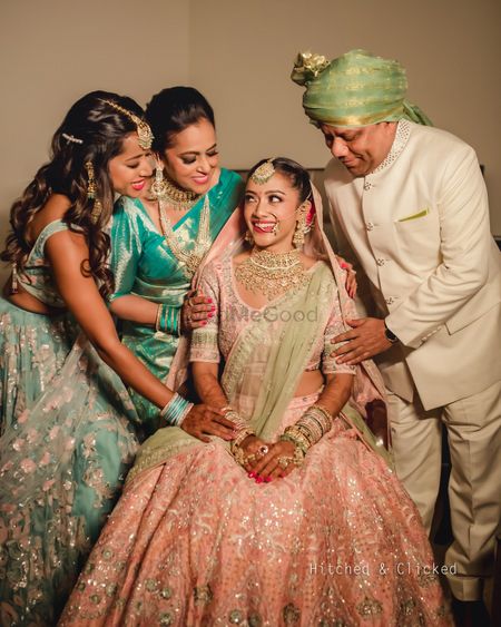 bridal portrait with her mom dad and sister
