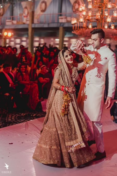 Photo of A bride twirls with her groom