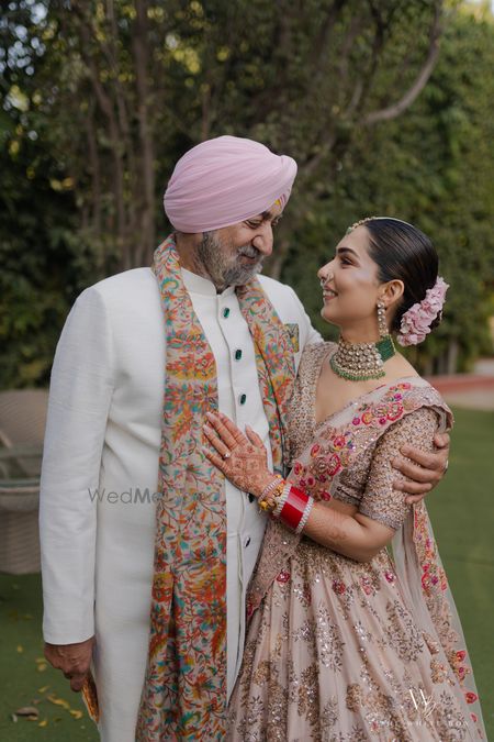 Photo of Cute candid capture of the bride with her dad on the wedding day