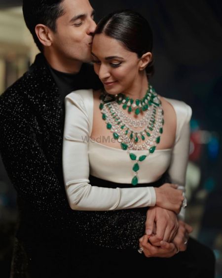Photo of kiara advani on her reception wearing an emerald and diamond statement necklace
