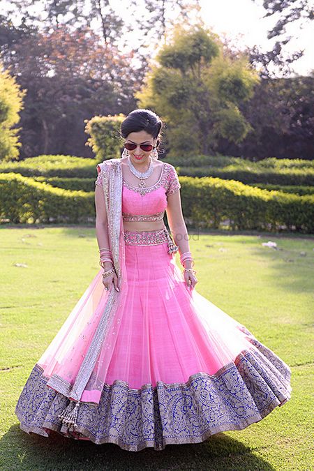 Photo of light pink and blue and gold lehenga