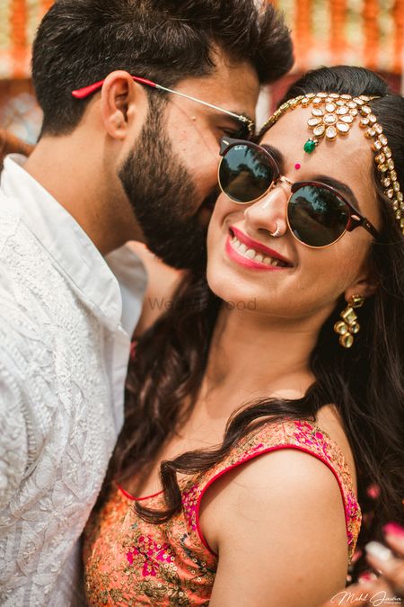 Mehendi couple portrait with bride in shades