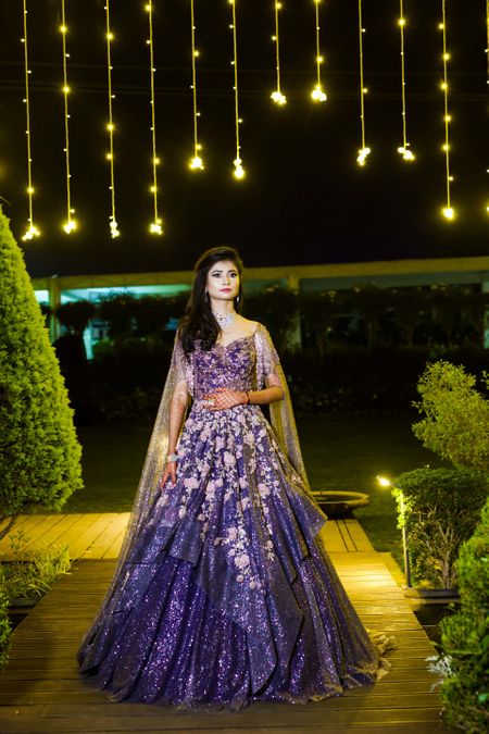 A bride in a purple shimmery gown for her cocktail