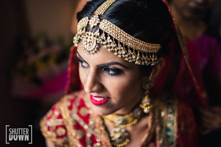 Photo of Statement bridal mathapatti with thick stands