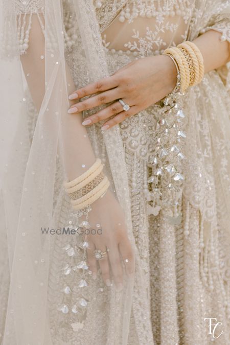 Photo of Unique and gorgeous silver kaleeras with butterfly motifs for the bride on the wedding day