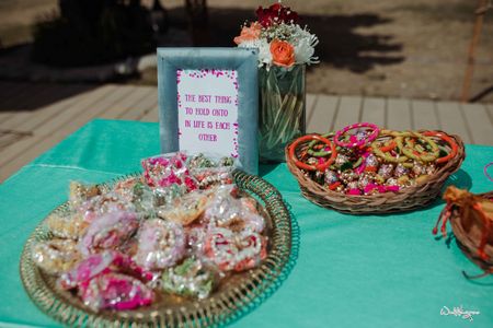 Photo of bangles as mehendi favours laid out on a table
