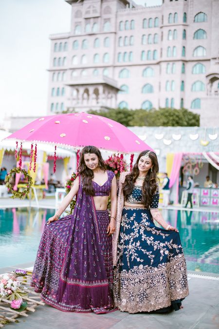 Sister of the bride in purple and teal lehengas